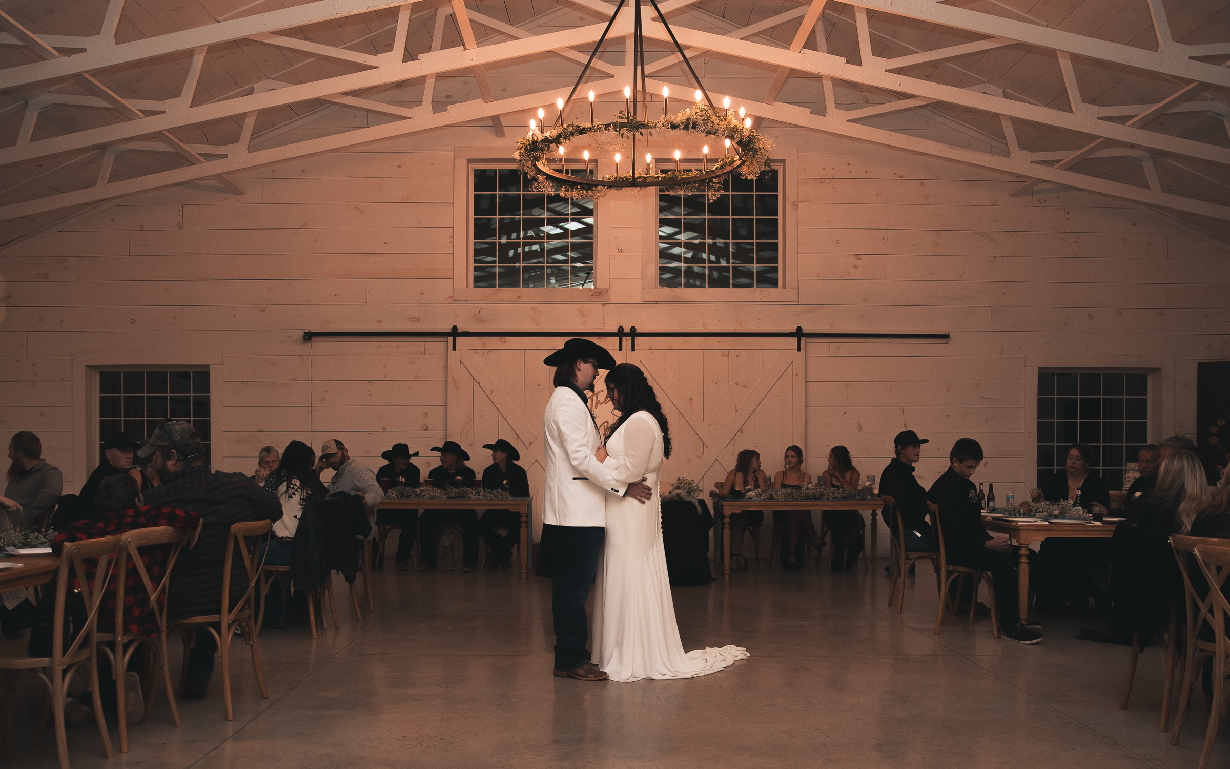 Bride and Groom have first dance in a low lit reception room at Sparrow Lane